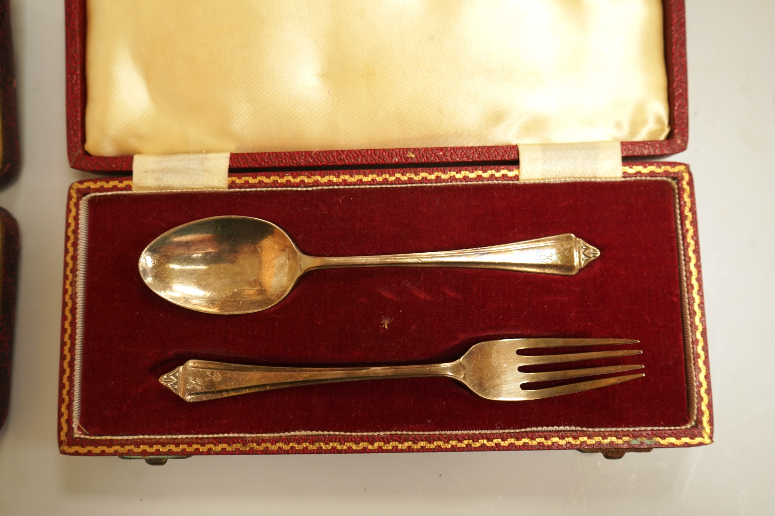 A cased set of six late Victorian silver teaspoons and matching sugar tongs, Miller Bros. Birmingham, 1900, together with three cased silver christening pairs.